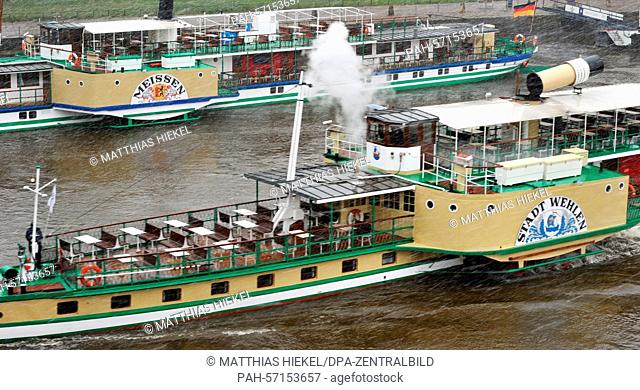 The passenger steamer 'Stadt Wehlen', built in 1879, opens the season of the Saxon steam navigation during snowfall on the Elbe river in Dresden, Germany