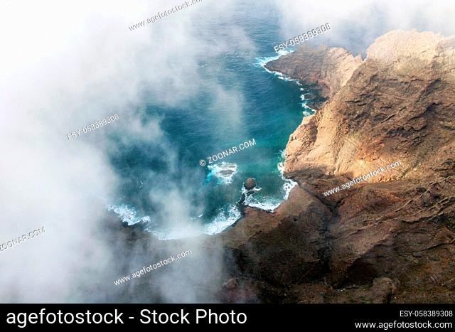Flying over a scenic landscape, cliffs and ocean in a remote volcanic landscape of Tenerife, Canary Islands. High quality photography