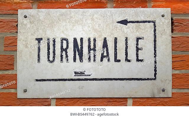 decaying sign of a gym (Turnhalle), entrance behind the house