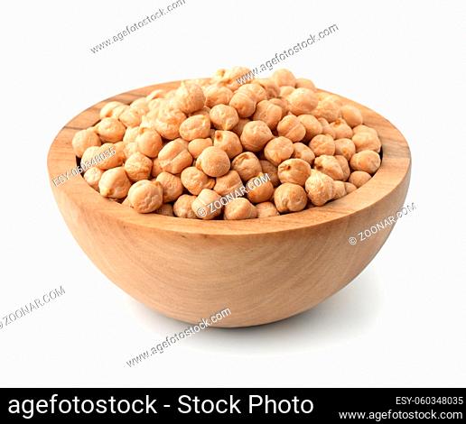 Wooden bowl full of raw chickpeas isolated on white