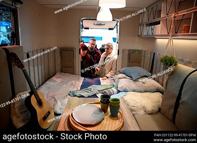 22 November 2023, Saxony, Leipzig: Visitors to the ""Touristik & Caravaning International 2023"" trade fair take a look at the interior of a motorhome