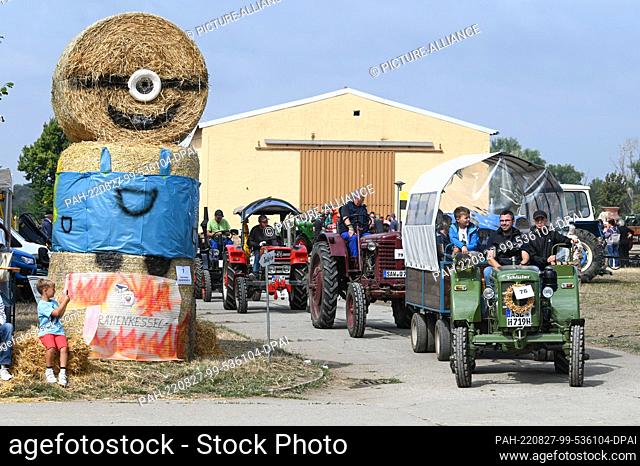 27 August 2022, Saxony-Anhalt, Bernburg: More than 80 agricultural machines took part in the historical technology parade