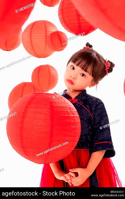 Beautiful little girl and red lanterns