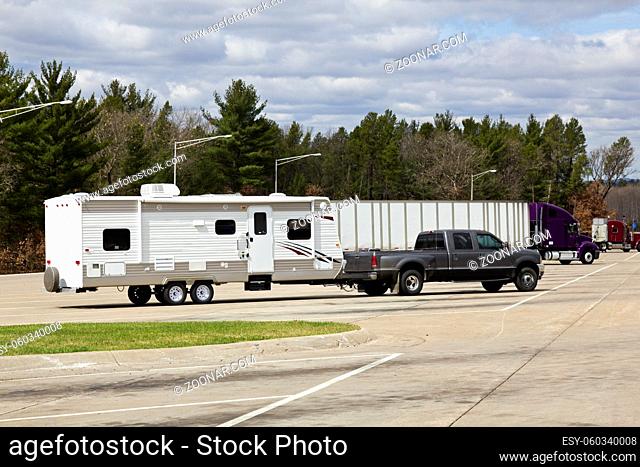 RV and Semi Truck parked on the rest area