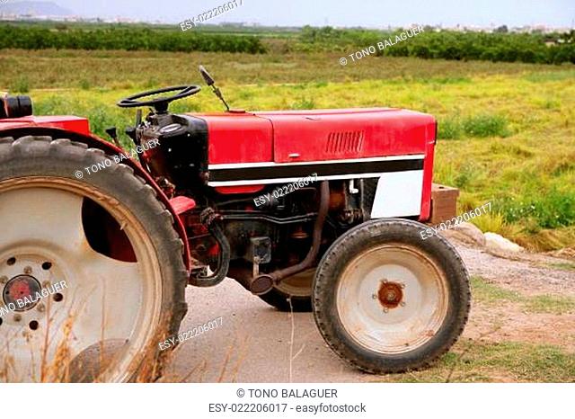 Agriculture aged red tractor retro vintage machine