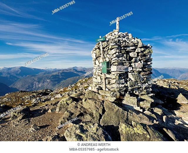 Top of mount Molden, stone cairn, view towards north, glacier Jostedalsbre in the background, Lustrafjord, Sogn og Fjordane, Norway, Europe