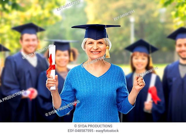 happy senior graduate student woman with diploma