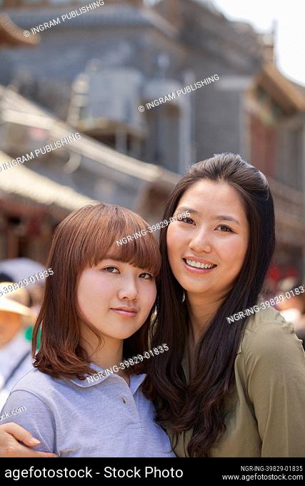 Portrait of two young girls in Beijing outdoors