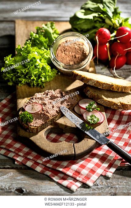 Liverwurst spread on slice of brown bread