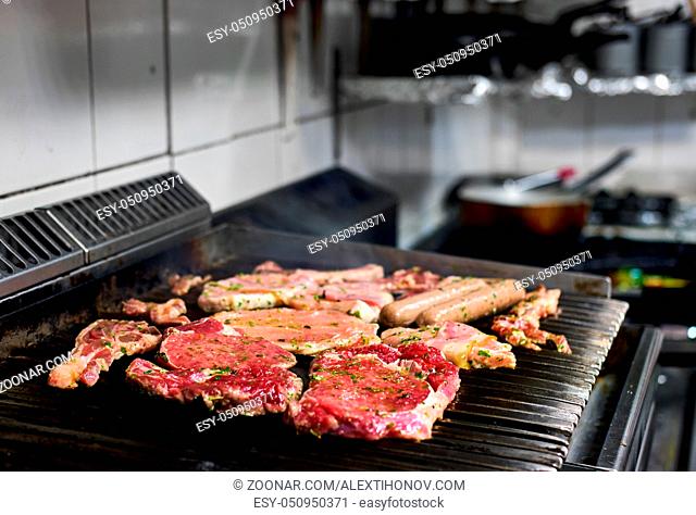 Assorted of a raw meat on the barbecue grill