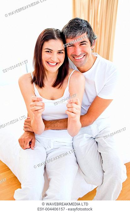 Enthusiastic couple finding out results of a pregnancy test