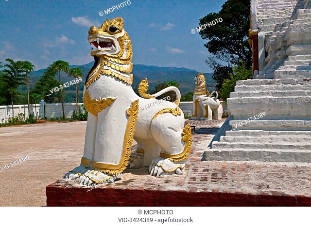 A CHINLE is half lion and half dragon and guards a BUDDHIST SHRINE - HSIPAW, MYANMAR - 06/05/2012