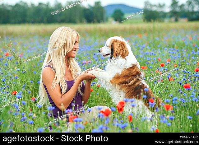 Young woman with dog, Bavaria, Germany, Europe
