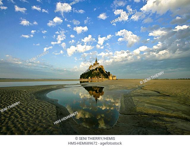 France, Manche, Bay of Mont Saint Michel, listed as World Heritage by UNESCO, Mont Saint Michel reflections in the light of the sunset