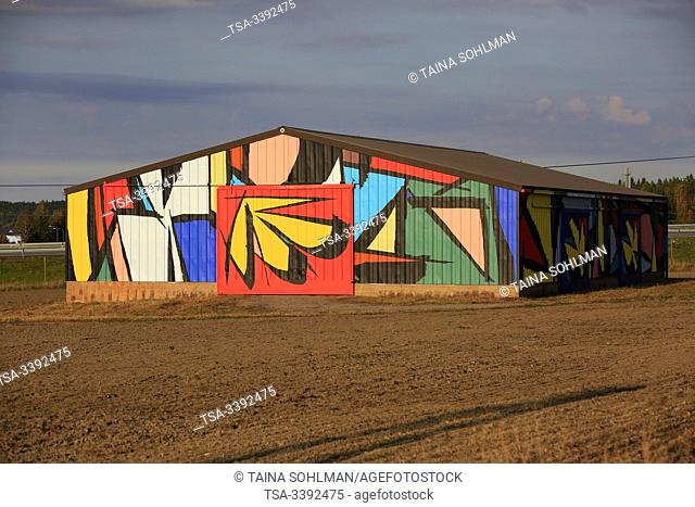 Salo, Finland. September 28, 2019. Abstract mural by Sobekcis on a barn in field near the national road 1, E18, in Salo, Finland