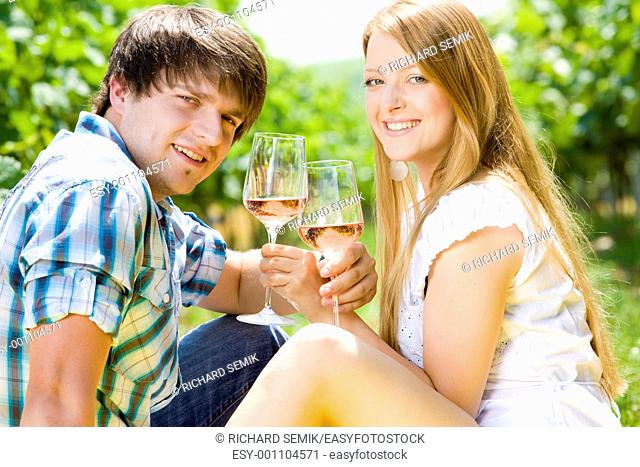couple at a picnic in vineyard