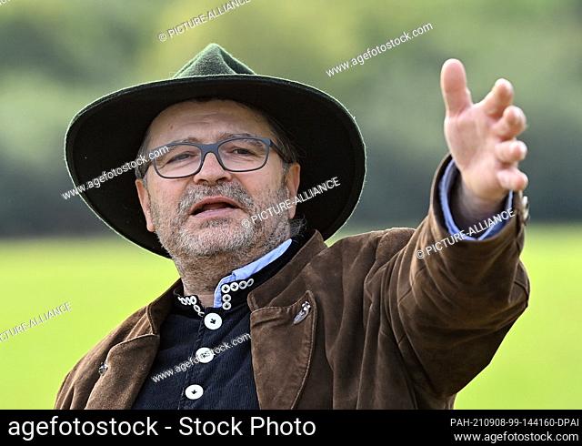 05 September 2021, Brandenburg, Altlandsberg: Knut Kucznik, master shepherd, takes a photo before the start of the Brandenburg Shepherds' State Performance...