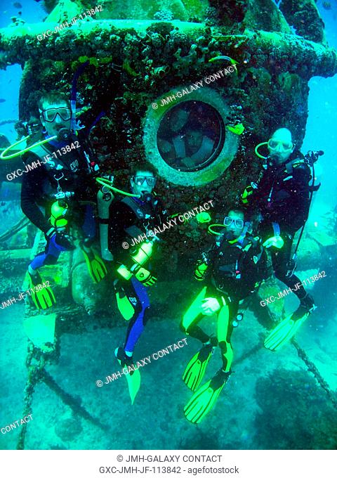 NEEMO 14 crew members pose for a group photo at their undersea habitat during the 14th NASA Extreme Environment Mission Operations (NEEMO) mission