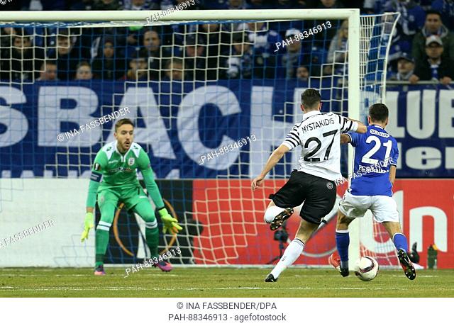 Alessandro Schoepf (r) of Schalke scores 1:0 against goalkeeper Panagiotis Glykos (L) and Giannis Mystakidis (M) from PAOK during the Champions League round...