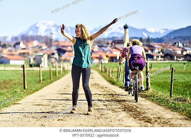 Lively woman on day trip at country side. Waakirchen, Bavaria, Germany