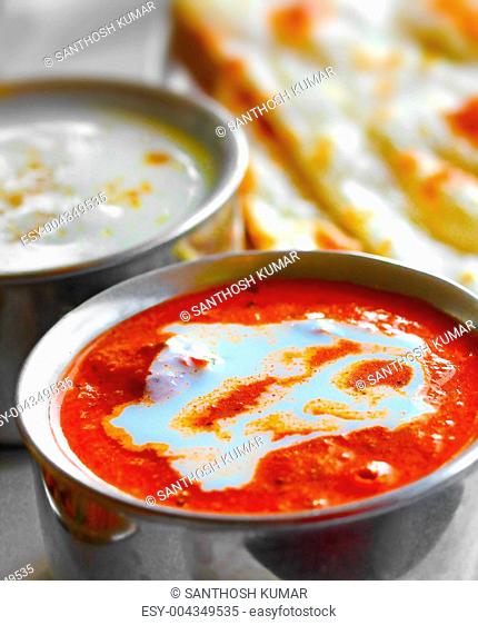 Indian curry, raitha and roti closeup