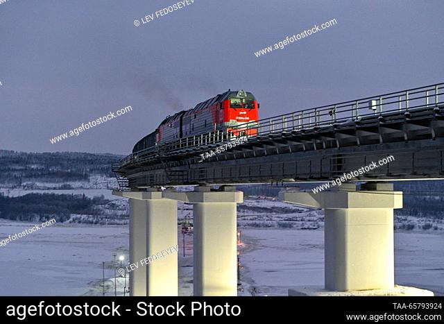 RUSSIA, MURMANSK REGION - DECEMBER 15, 2023: A train moves along the newly-launched Vykhodnoi - Lavna railway line leading to a new sea port in the Kola Bay