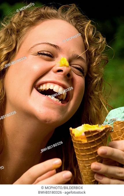 Laughing woman with ice on her nose
