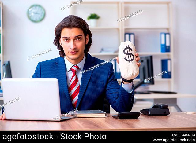 The young male businessman working in the office