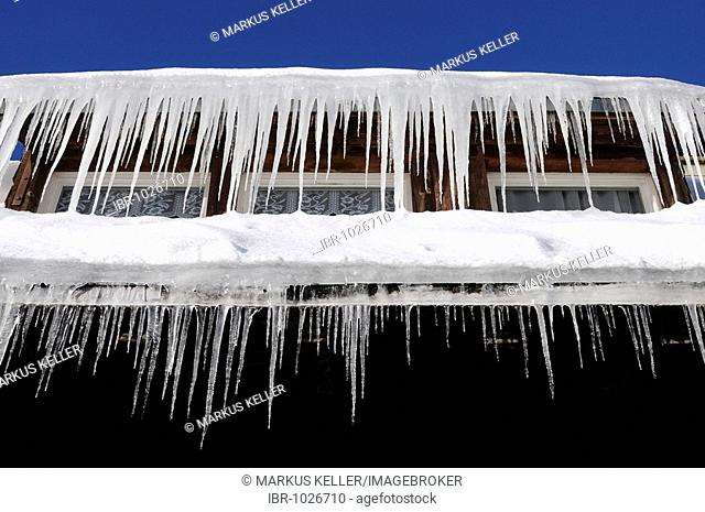 Icicles hanging from a roof gutter