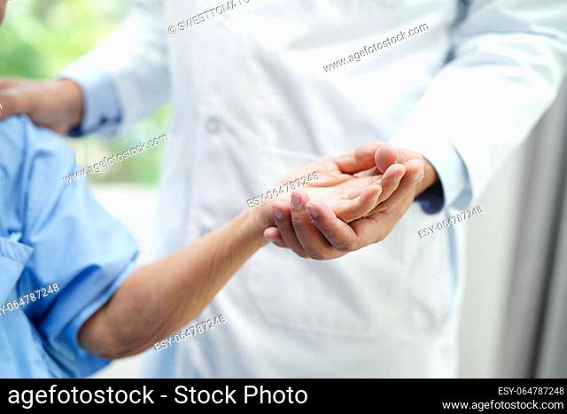 Doctor holding hands Asian elderly woman patient, help and care in hospital