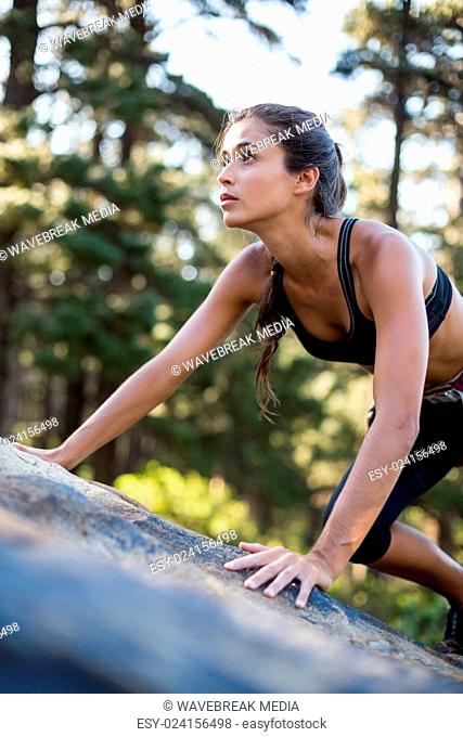 Portrait of woman rock climbing