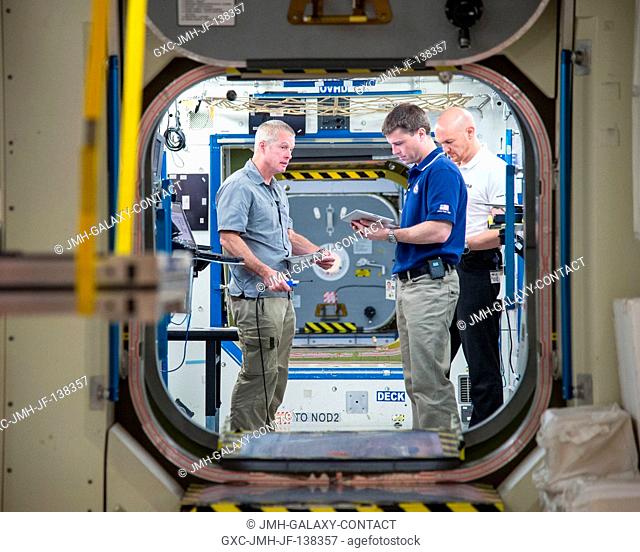 NASA astronaut Steve Swanson (left), Expedition 39 flight engineer and Expedition 40 commander; NASA astronaut Reid Wiseman and European Space Agency astronaut...