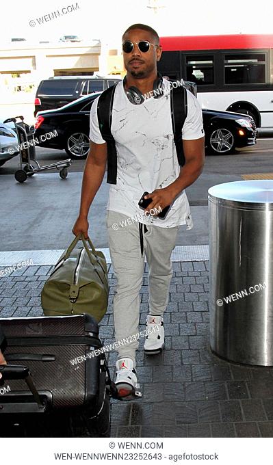 'Creed' star Michael B. Jordan departs on a flight from Los Angeles International Airport (LAX) carrying a backpack and holdall Featuring: Michael B