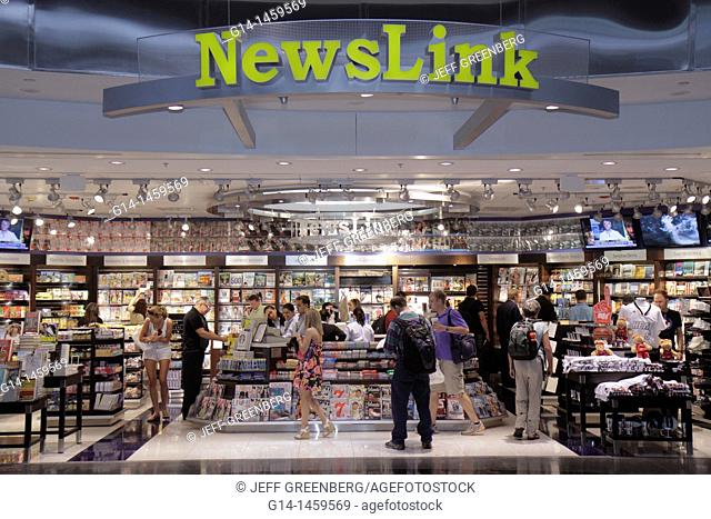 Florida, Miami, Miami International Airport, MIA, terminal, concourse, gate area, shopping, NewsLink, newsstand, books, magazines, man, men, woman, women