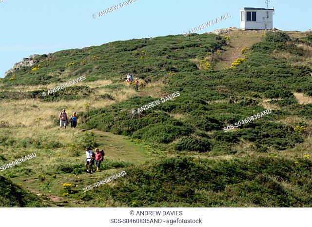 People walking on coast path, Coastguard Hut, Deer Park, Marloes, Pembrokeshire, Wales, UK, Europe