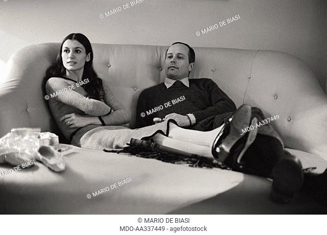 Carla Fracci with her husband Beppe Menegatti on the sofa of their house. The Italian ballet dancer Carla Fracci, recently awarded with the Dance Magazine Award
