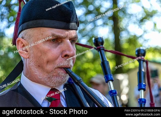 16 September 2023, Saxony, Trebsen: A participant in the 22nd International Highland Games blows a bagpipe. The biggest Scottish event in Germany is under the...