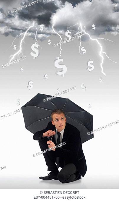 Young business man holding an umbrella