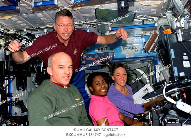 Astronauts Stephanie D. Wilson (center) and Lisa M. Nowak (right), STS-121 mission specialists, work with the Mobile Service System (MSS) and Canadarm2 controls...