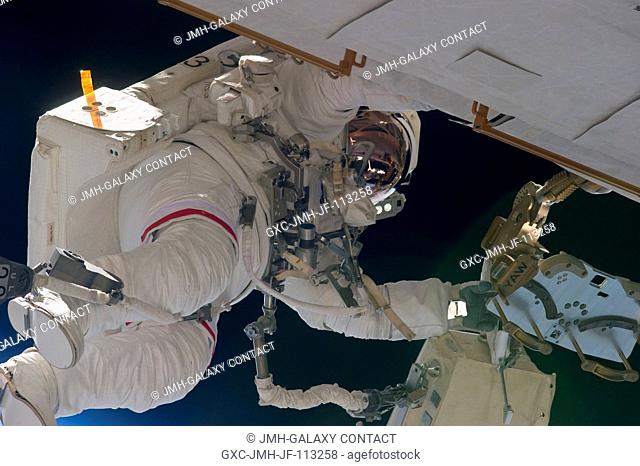 NASA astronaut Andrew Feustel, STS-134 mission specialist, participates in the mission's second session of extravehicular activity (EVA) as construction and...
