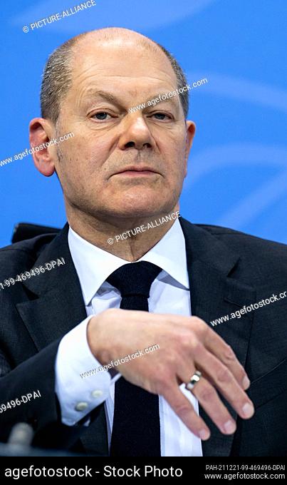 21 December 2021, Berlin: Chancellor Olaf Scholz (SPD) speaks at a press conference after the consultations on the Corona pandemic between the Federal...