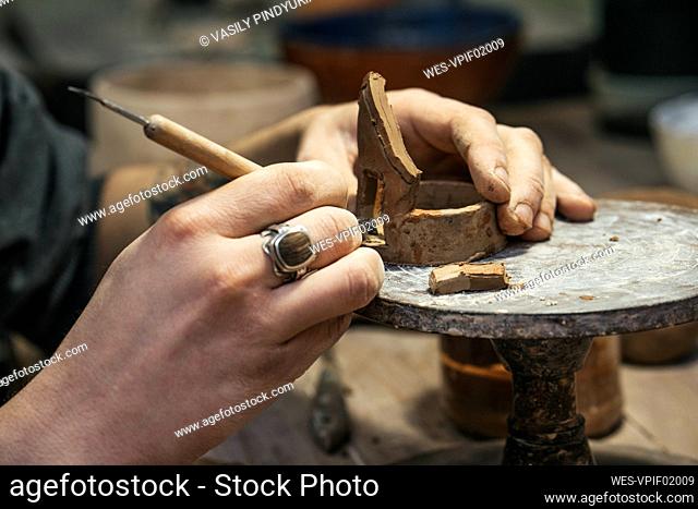 Close-up of potter working on workpiece