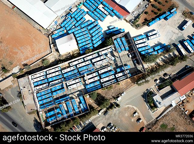 Drone aerial top view.photo of abandoned transport Blue buses parking. shabby and broken vehicle. Junkyard of buses Cyprus