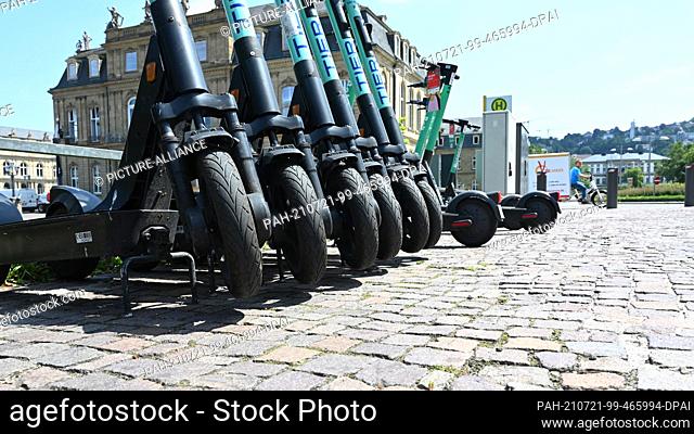 21 July 2021, Baden-Wuerttemberg, Stuttgart: A number of e-scooters are available for rent in the city centre in front of the New Castle