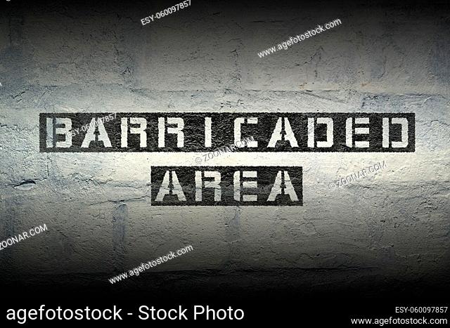 barricaded area stencil print on the grunge white brick wall