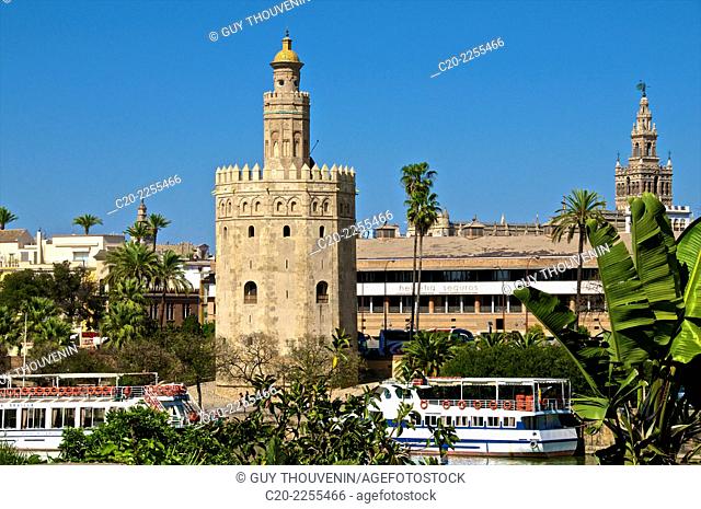 Boats on Guadalquivir river with Torre del Oro, Sevilla, Andalusia, Spain