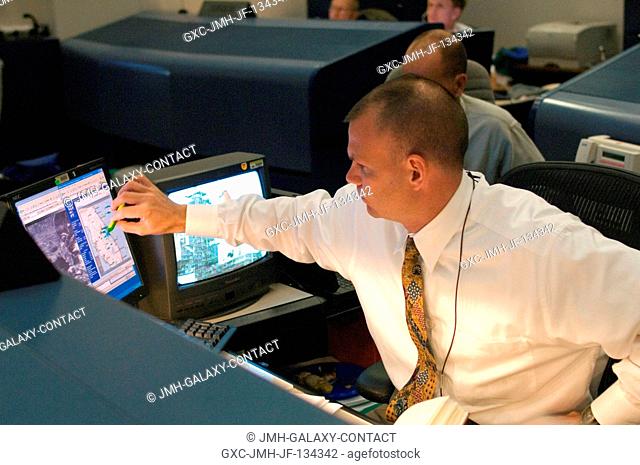 At the spacecraft communicator (CAPCOM) console in the Shuttle (White) Flight Control Room of Houston's Mission Control Center (MCC), astronaut Dominic A