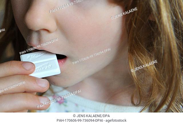 FILEÂ - A file picture dated 26 April 2011 shows a girl bringing a piece of Dextro Energy to her mouth, in Berlin, Germany