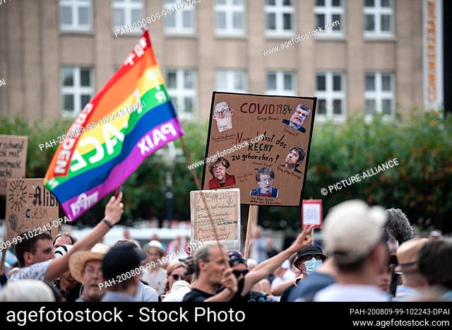 09 August 2020, North Rhine-Westphalia, Dortmund: A participant in the demonstration holds a sign in the air that says ""No one has the right to obey""