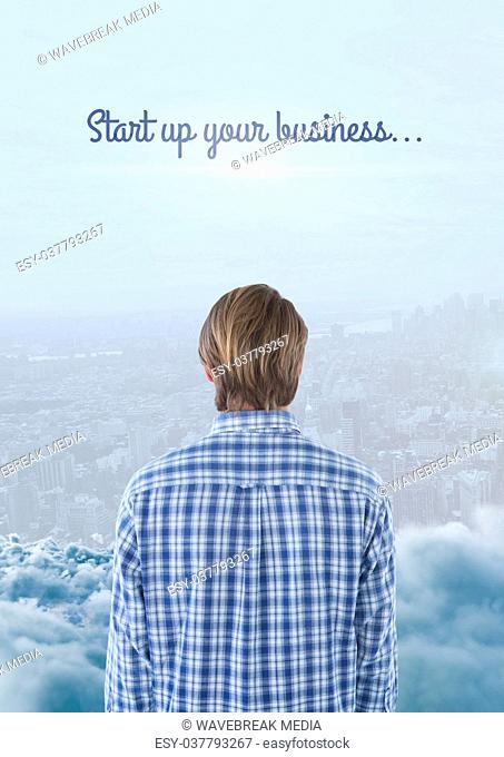 Man looking out across city with text at top